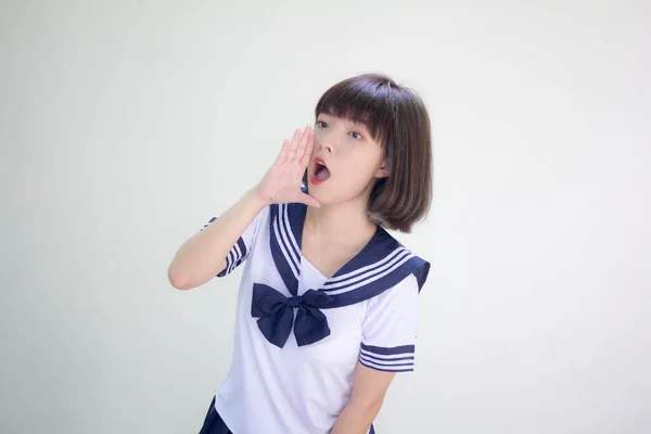 学生大喊中的日本少女 免版税图库照片