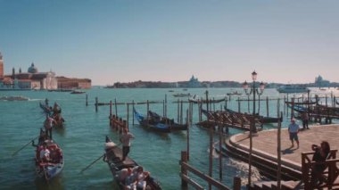 Italy - Venice, 27 September 2022. Venice lagoon on a sunny day with passing boats and gondolas. 