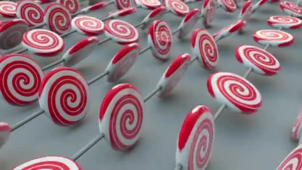 Randomly Rotating Red White Spiral Lollipops Candy Stick White Background — Video