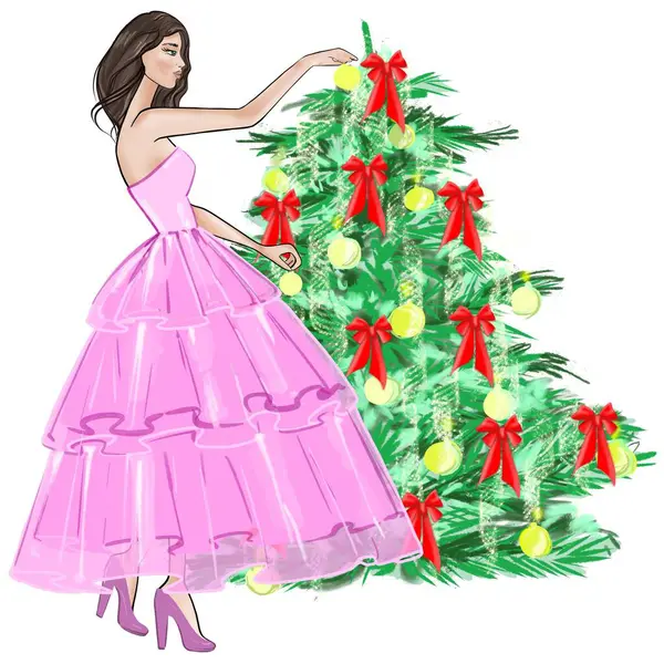 Beyaz arka planda pembe elbiseli bir Noel ağacı modayla süsleyen kadın.