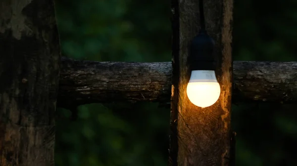 stock image Small light bulbs decorated on wooden fence                 