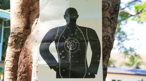 Shooting target on tree in a shooting range