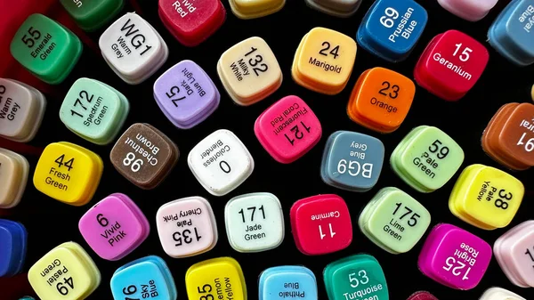 Close up colorful color pen caps with names and number of colors