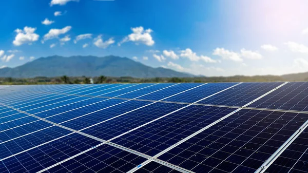 Dirty solar cell panels with blur mountains background concept of save environment save lives