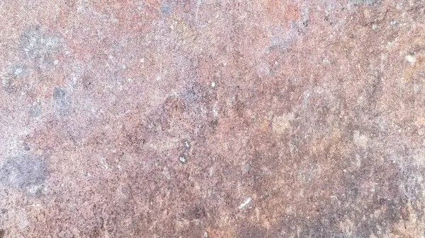 Paslı metal arkaplan görüntüsünü kapat. Metal açık bir alanda güneşin altında ve yağmurda kalır.