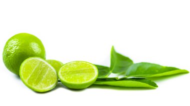 Whole limes and lime halves placed on a white background, highlighting the freshness and vibrant color of the fruit. clipart