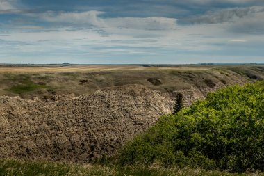 Badlands on the edge of farm land Tolman Badland Hertige Range Natural Area Alberta, Canada