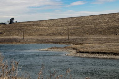 Low spring water level along the shore line. Dickson Dam Provincial Recreation Area, Red Deer County, Alberta, Canada