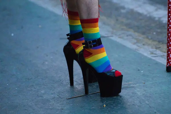 Detail of a drag queen\'s high heels with rainbow socks at the gay pride event for gay and LGBTQ rights in the city of Seville, Spain. Concept of equality and gay rights