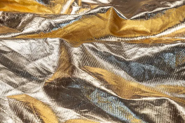 Soyut altın kumaş arkaplan dokusu 
