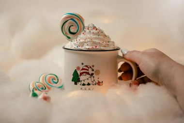 Hot chocolates surrounded with christmas decorations. Sweet hot chocolates with whipped cream. Christmas concept. clipart