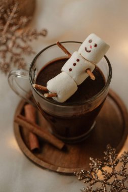 Hot chocolates surrounded with christmas decorations. Sweet hot chocolates with whipped cream. Christmas concept. clipart