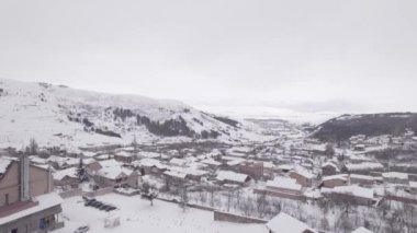 Small Village in a Frozen Snowy Mountains. Town.