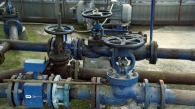 Old, rusty water pipe. Water pressure valve station plant industrial treatment purification equipment