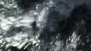 A muddy river with brown water. Slow current. A muddy river during a winter flood. dirty river. Dirty water of muddy river in flooding period during heavy rains in spring.