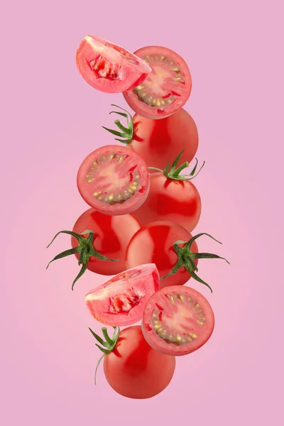 Creative layout made form Tomato on a pastel pink background