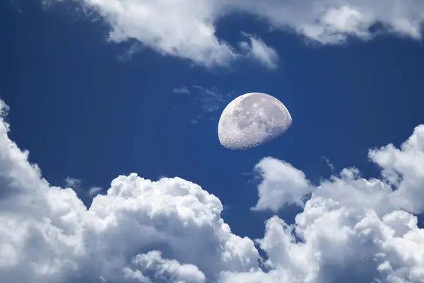 Blue sky and white clouds with moon, beautiful background of blue sky with white clouds an a full moon