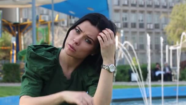 Serene Woman Fountain Park Her Hand Gracing Face Brunette Tending — Stock Video