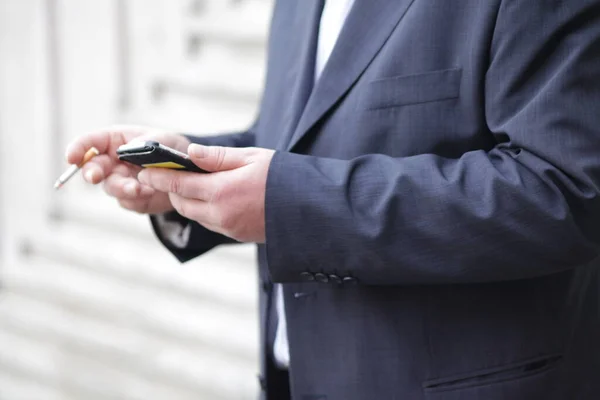 Businessman Suit Holding Cigarette Texting Cellular Phone — Stock Photo, Image