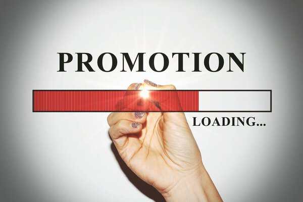 Woman hand with glitter nails showing the Loading Bar with the text promotion, concept of big sale soon.