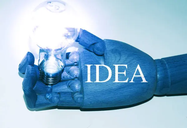 Robot Hand Holding Lamp Bulb Text Idea — Stock Photo, Image