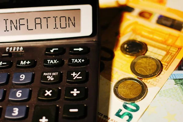INFLATION word on calculator. Business and tax concept.