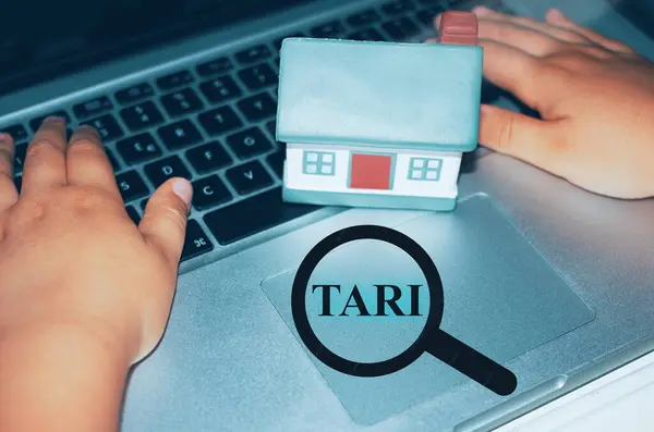 Person searching for a house conceptual photo.House with a magnifier with the text \