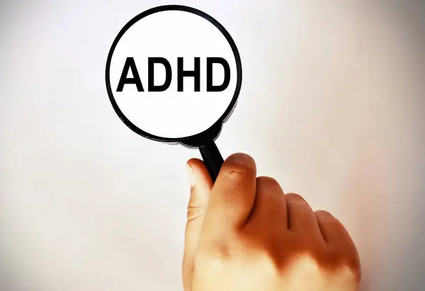 Magnifying Glass 3d Illustration showing ADHD . Concept of attention deficit hyperactivity disorder and early age mental disorder on concentration