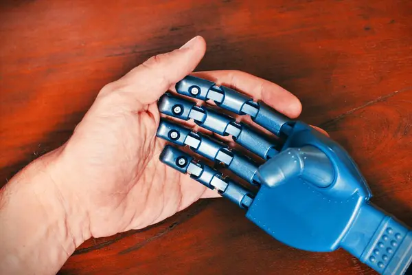 Man and robot hands collaboration friendship conceptual design