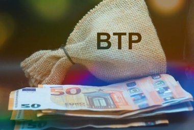 European banknotes with BTP in a rough burlap sack translating as Italian government bonds clipart