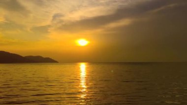 Beautiful sunset on the beach with calm sea square