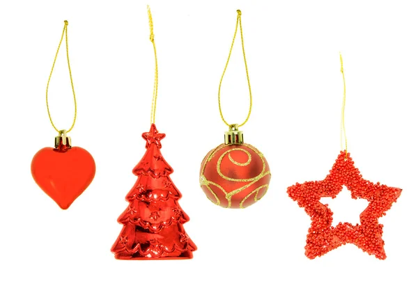 挂在白色背景上的红色圣诞装饰品系列 免版税图库图片