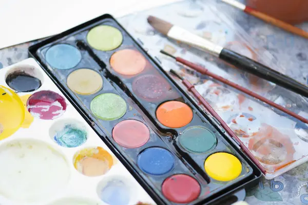 stock image paint set and palette with brush for child.