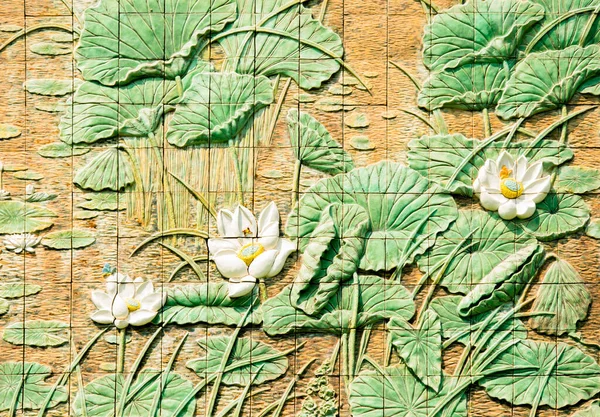 The wall are decorated with lotus pattern of tiles, texture background