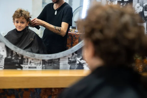 Young Boy Looks Worried While Getting Haircut Barbershop Stockbild