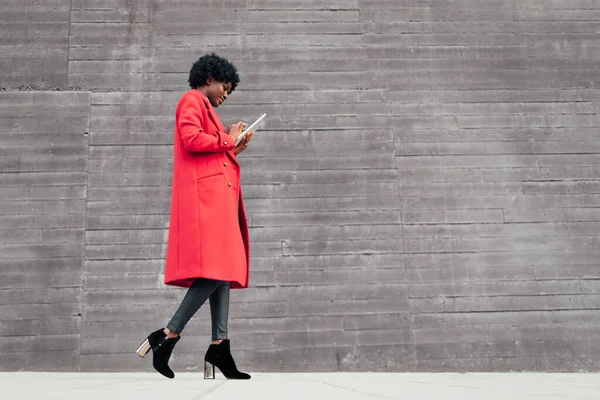 Stylish Woman Using Digital Tablet While Walking Outdoors Street Technology Stockbild