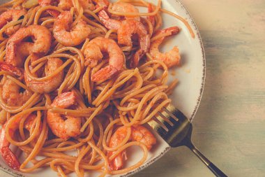 Spaghetti with king shrimps , with spices, top view, selective focus, homemade, no people,
