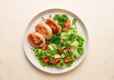 Fried cutlets, turkey, with vegetable salad, top view, no people,