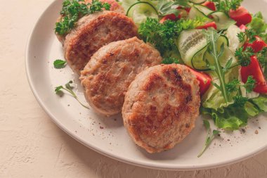 Fried cutlets, turkey, with vegetable salad, top view, no people,