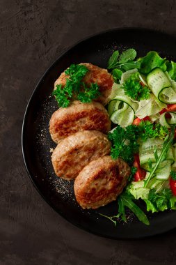 Fried cutlets, turkey, with vegetable salad, top view, no people,