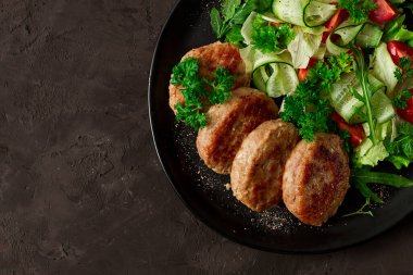 Fried cutlets, turkey, with vegetable salad, top view, no people,