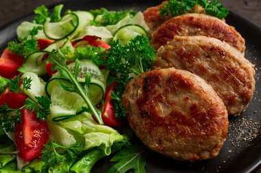Fried cutlets, turkey, with vegetable salad, top view, no people,