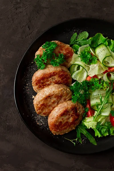 Fried cutlets, turkey, with vegetable salad, top view, no people,