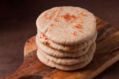 Pita bread, stack, on the table, no people,