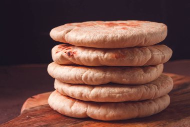 Pita bread, stack, on the table, no people,