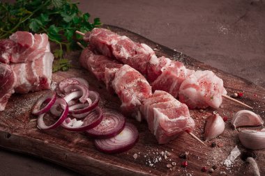 Raw pork meat, on wooden sticks, pickled kebab, with spices, top view, no people,