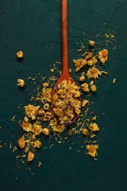 Chrysanthemum buds, tea, on a wooden boat, top view, no people,