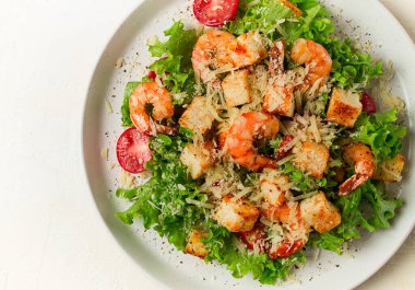 caesar salad, with shrimp, on a white background, homemade, no people,