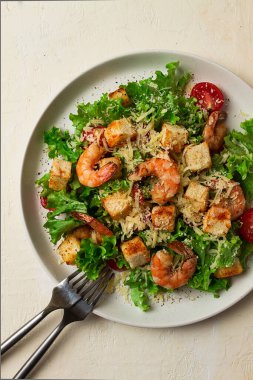 caesar salad, with shrimp, on a white background, homemade, no people,