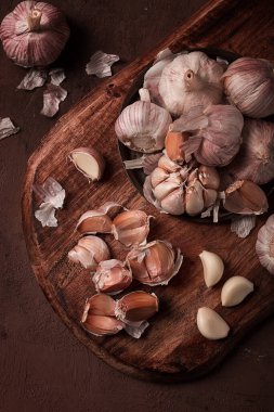 Fresh garlic, on a dark background, top view, food concept,
